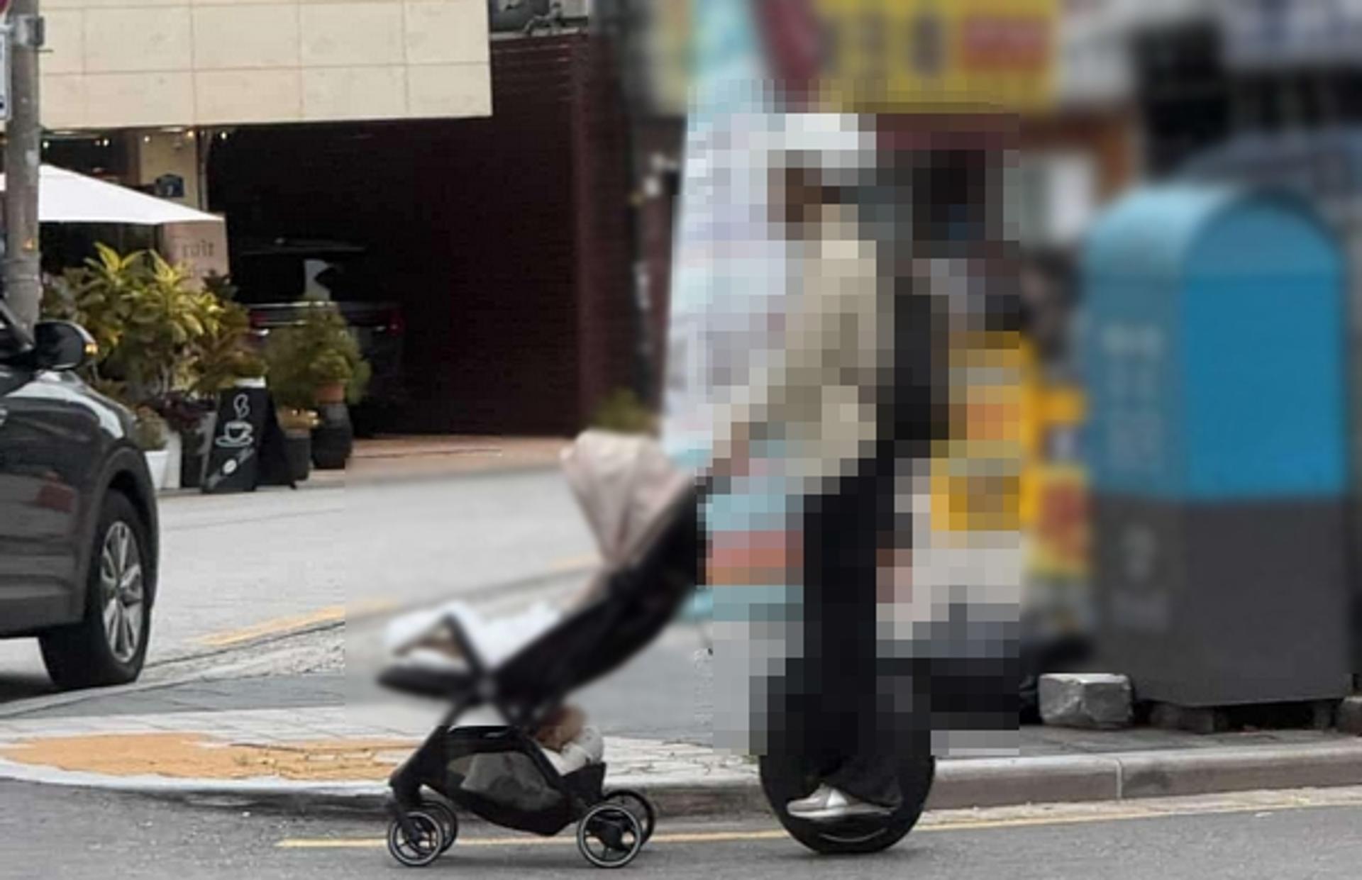 "아기가 에어백인가"… 외발 전동휠 타며 헬멧 쓰고 유모차 끄는 남성